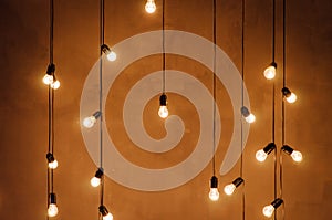 Garland of edison lamps on a wooden backgroundn