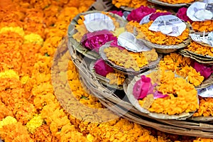 Floating garlands of flowers and floating candles placed by pilgrims on the river Ganges as offerings. photo