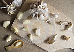 Garlic Bulb and Garlic Cloves on Wooden chopping board