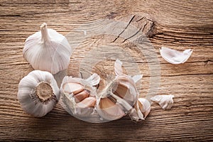 Garlic bulbs and cloves on wooden table