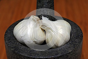 Garlic bulbs and mortar and pestle