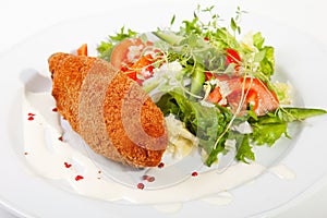 Garlic chicken kiev with mixed leaf salad