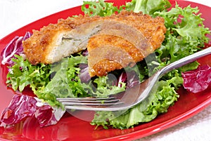 Garlic chicken kiev with seasonal salad