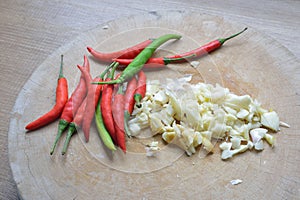 Garlic and chili on chopping block
