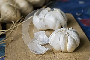 Garlic on chopping board photo