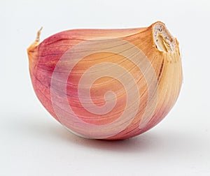 Garlic. Closeup of Purple garlic clove isolated on white background