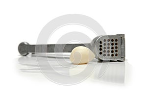 Garlic clove and crusher