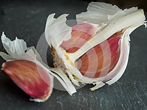 Garlic clove split on a slate base