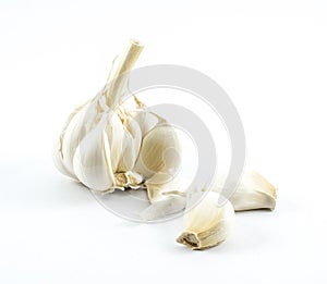 Garlic and cloves on a white background