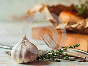 Garlic cloves on wooden vintage background roasted chicken on on background
