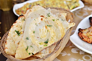 Garlic and coriander naan on a basket