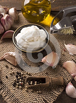Garlic dip on wooden background