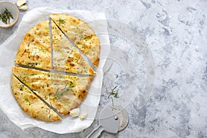 Garlic foccacia bread. Freshly baked flat garlic bread with olive oil and herbs.Copy space photo