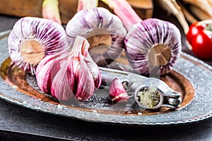 Garlic. Fresh garlic. Red garlic. Garlic press. Violet garlic.Garlic background. garlic bulbs