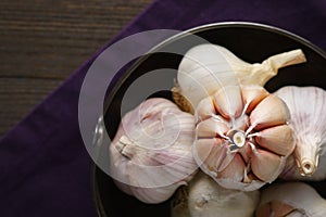 Garlic and garlic cloves on dark