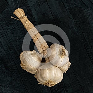 Garlic grappe on a black background