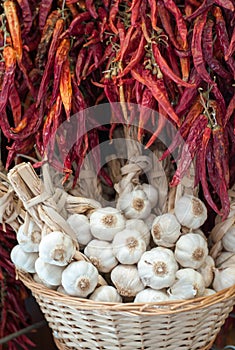 Garlic heads and red chili at market stall