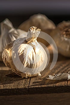 Garlic heads on a wooden board