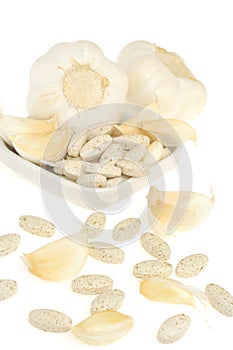 Garlic and herbal supplement pills isolated