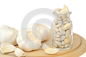 Garlic and herbal supplement pills isolated