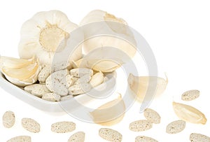 Garlic and herbal supplement pills isolated