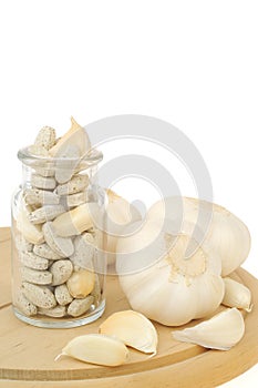 Garlic and herbal supplement pills isolated