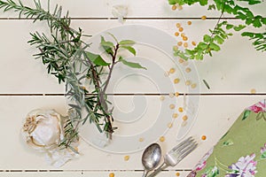 garlic and herbs on a cream background