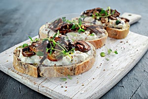 Garlic mushroom toast with creamy herbed ricotta chees spread