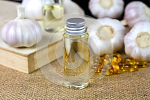 Garlic oil in transparent bottle with Garlic oil capsule soft gel.