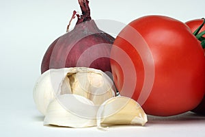 Garlic, onion and tomato