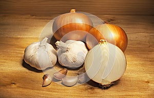 Garlic and onionon on wooden table
