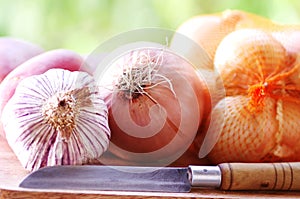 Garlic, onions and knife
