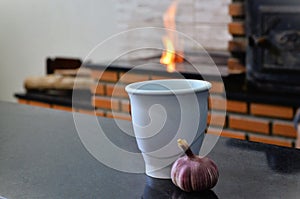 Garlic and pestle cup on table for use photo