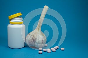 Garlic and pills, alternative medicine concept