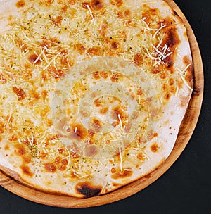 Garlic pizza bread with cheese and herbs