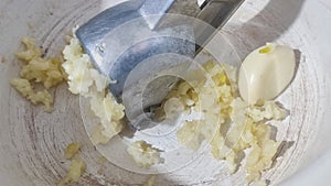 garlic in garlic press, food vegetables fresh