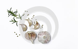 garlic, rosemary, peppercorn isolated on white background