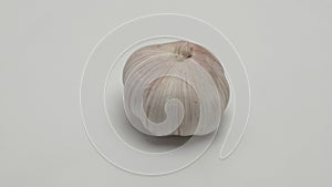 Garlic rotates on a white background.