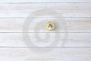 Garlic sauce in small bawl for dipping, on wooden background, top view photo
