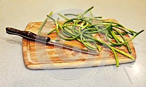 Garlic Scapes on a Cutting Board