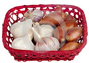 Garlic and shallots on a red basket