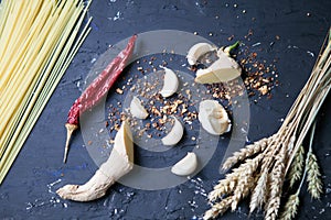 Garlic, species and ginger on a black background. Food ingredients. Cooking concept.Food photo. Fresh natural garlic on black