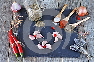 Garlic and spices on the slate.