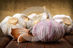 Garlic and a whole wooden table closeup