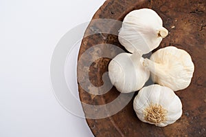 Garlic on a wooden plate