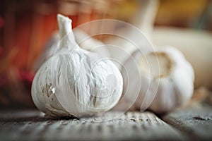 Garlic on a wooden table. Autumn background. Selective focus.