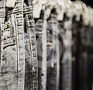 Garment rack with classic Jeans close up shot