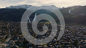 Garmisch Partenkirchen at Winter. Aerial view of Bavarian village in Alps mountains. Sunny day in Germany, Europe.