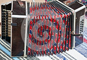 Russian Harmon is an old tongue keyboard-pneumatic two-row musical instrument photo