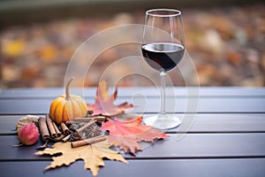garnacha red wine with a backdrop of fall leaves photo